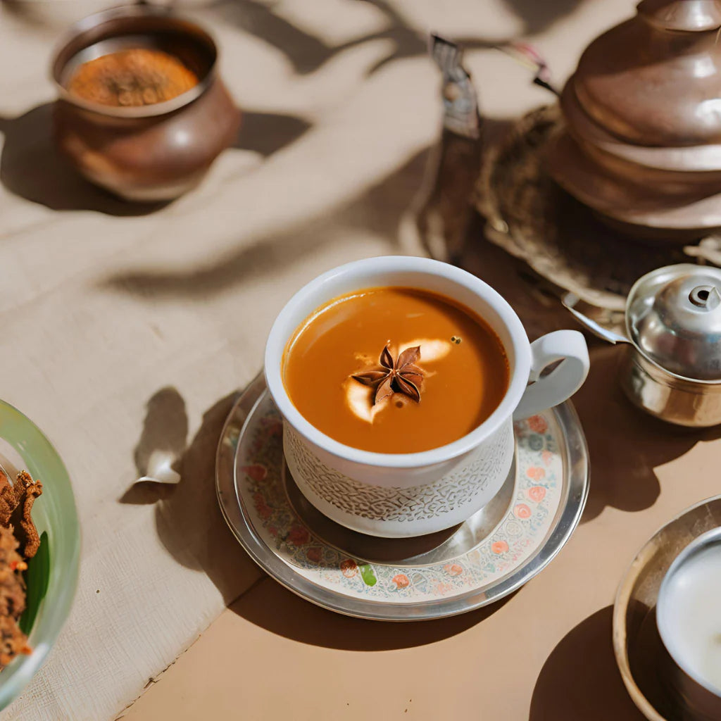 white cup on a saucer with kadak chai